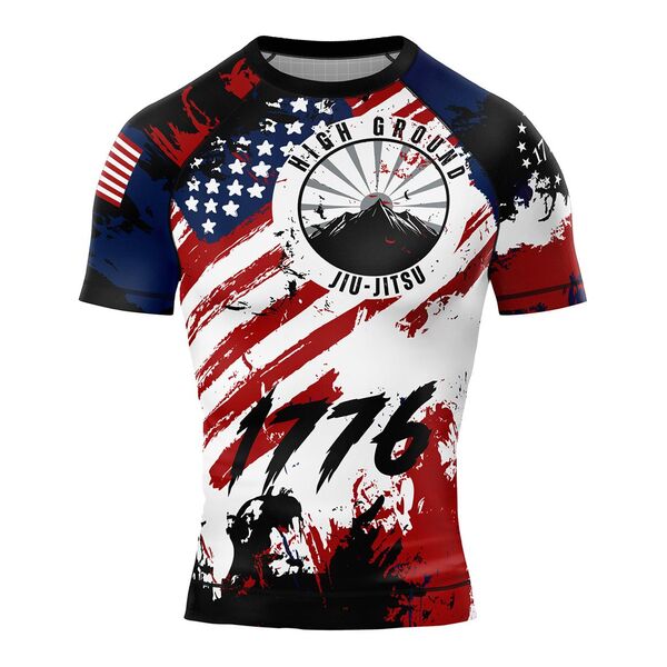 Rash guard printed with a distressed American flag, the High Ground Jiu-Jitsu logo and 1776