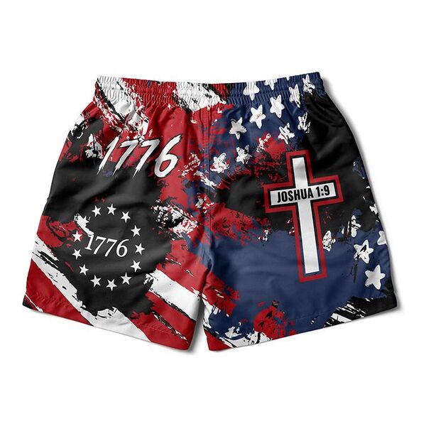 Grappling shorts printed with a distressed American flag, 1776 and a cross reading Joshua 1:9