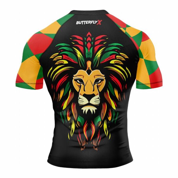 Back of a black rash guard with red, green and gold checkered sleeves and a lion's head