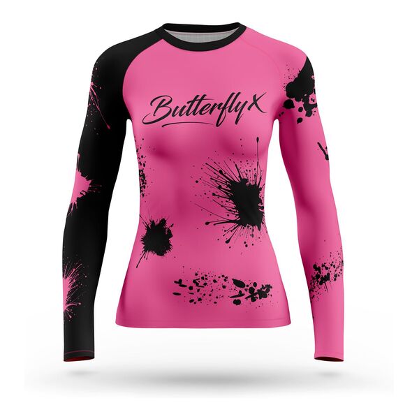 Long sleeve pink rash guard with black sleeves, black ink splatter and the ButterflyX logo in script